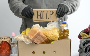 Collects food, fruits and things in a cardboard box to help the needy and the poor